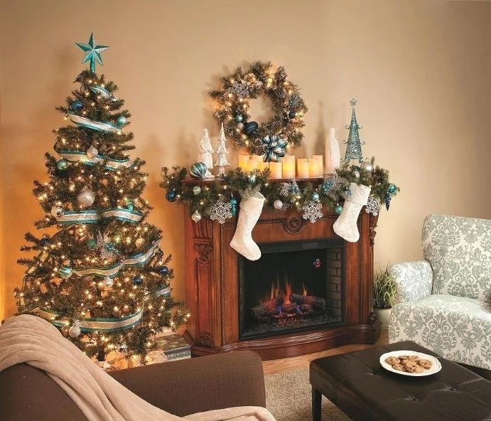 traditional living room, with a wooden mantelpiece, decorated with stockings, and a fir garland, covered in white and blue ornaments, fireplace mantel decor, christmas tree and a wreath
