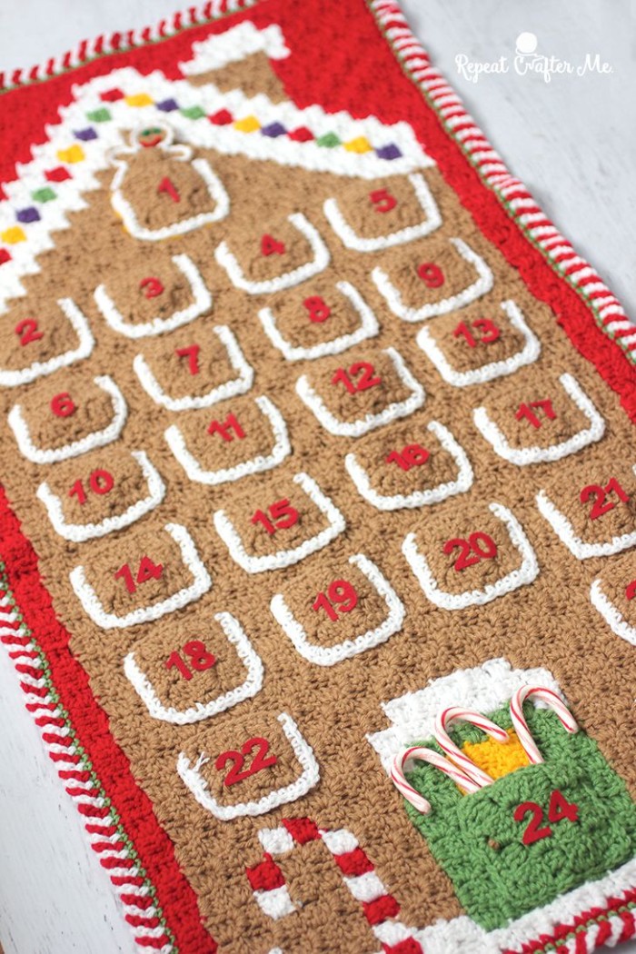 fun advent calendars, beige and red, crochet advent calendar, with white and yellow, green and blue details, and 24 numbered pockets