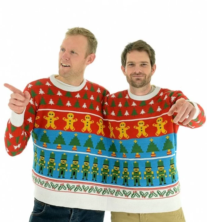 retro pattern featuring gingerbread men, christmas trees and nutcrackers, and little holly branches, on the ugliest christmas sweater, in red and teal, white and green, shared by two men