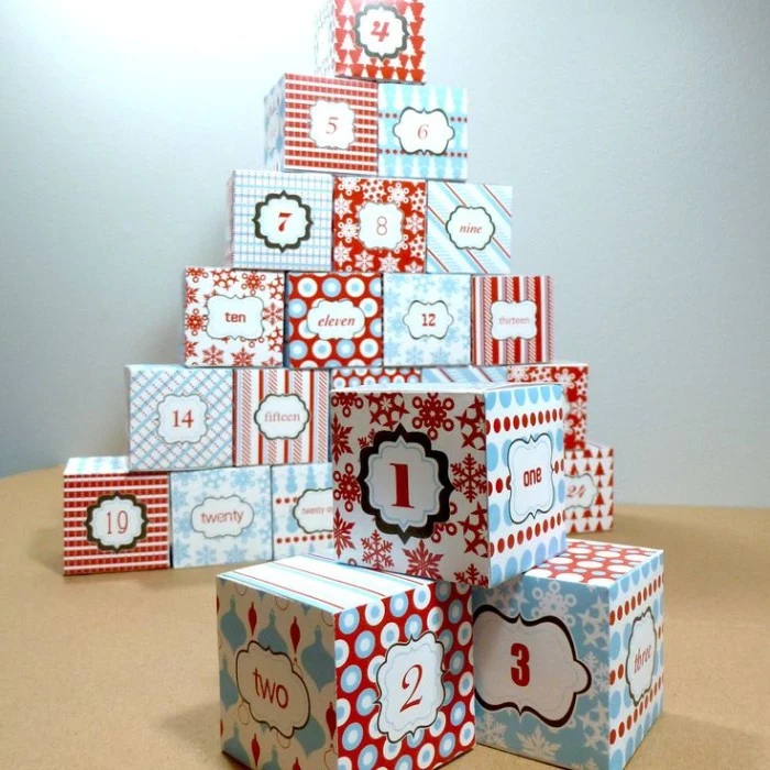cube-shaped numbered small boxes, made from patterned card, in light blue and red, white and black, fun advent calendars 