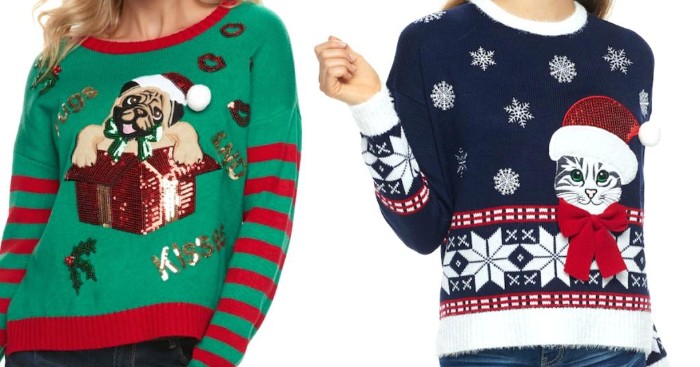 kitten and puppy, wearing christmas hats, on a green and red, and a dark navy, white and red jumpers, ugly sweater ideas, worn by two women