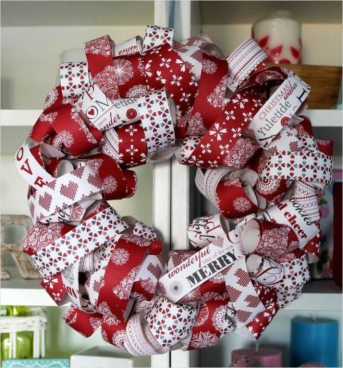 an alternative way of making a christmas wreath, using rolled patterned paper, in white and red, with festive motifs and messages