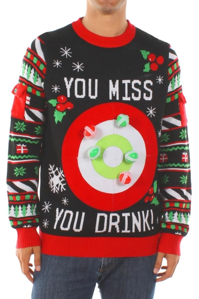 close up of a black jumper with red, green and white motifs, featuring snowflakes and presents, holly branches and xmas trees, and a large target, with the words you miss you drink 