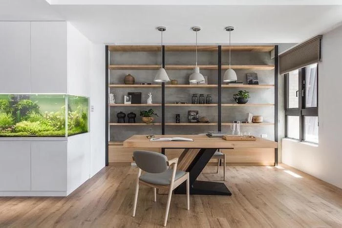 large fish aquarium, wooden desk and bookshelves, work office decorating ideas, two small grey chairs