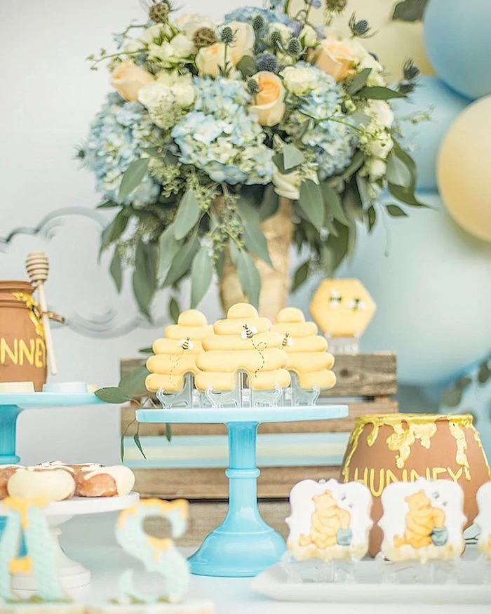blue and yellow flower bouquets, honey pots and cookies, baby shower party ideas, blue cake stand