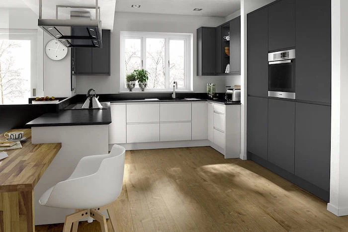 black cabinets and counters, white cabinets and drawers, beautiful kitchens, wooden floor