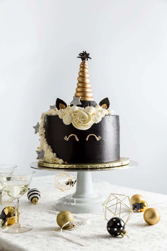 how to make a unicorn cake, white roses on white fondant, gold horn, gold and white cake stand