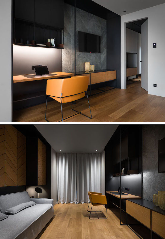 black and grey wall, black bookshelves, wooden desk, brown leather chair, office design