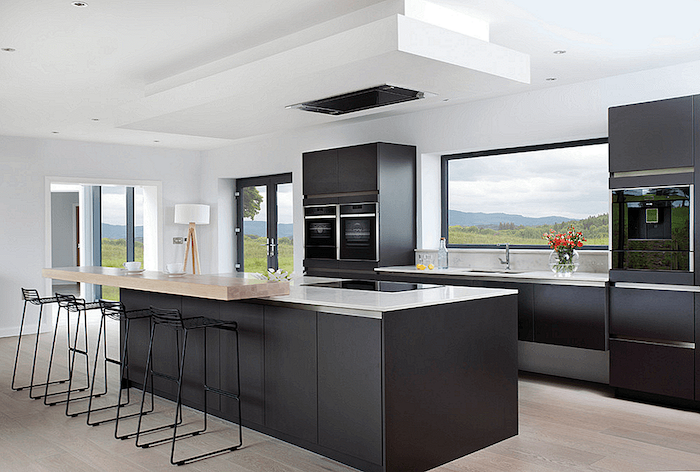 black kitchen island, metal black stools, kitchen decor ideas, black cabinets, white counters