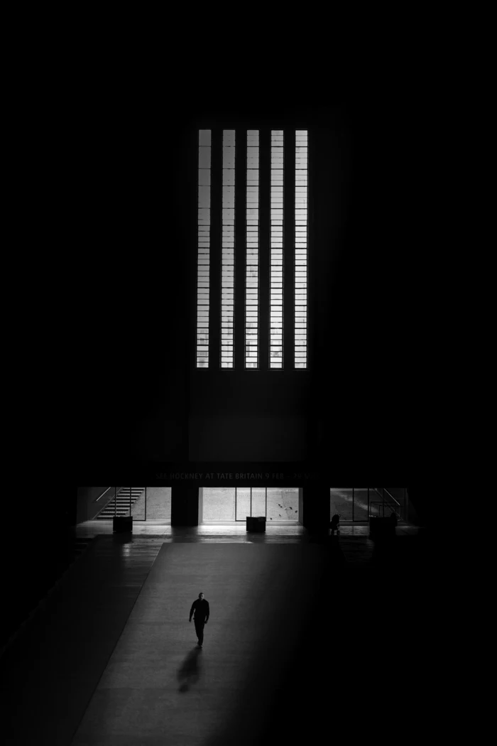 black background, best iphone wallpapers, lighting through windows, man walking