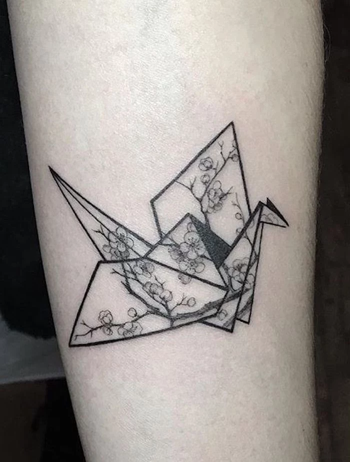 origami bird with flowers, tree branches, tattoo motifs