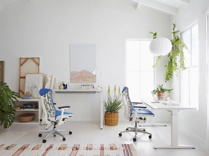blue chairs, white desks, hanging lantern, modern home office, white walls and floor with a rug