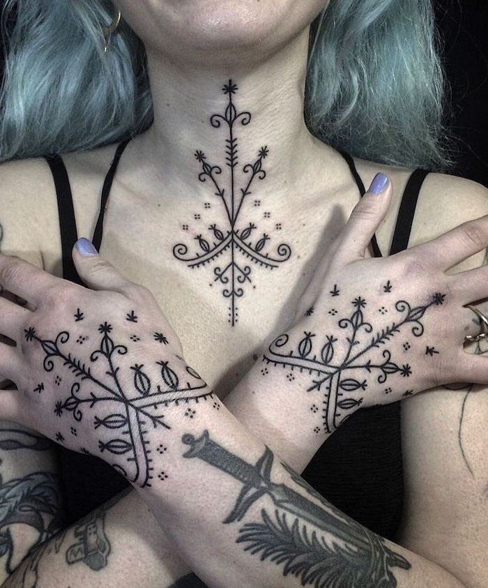 symmetrical arrows and dots tattoos on neck and hands, tattoo between breast, blue hair, black background