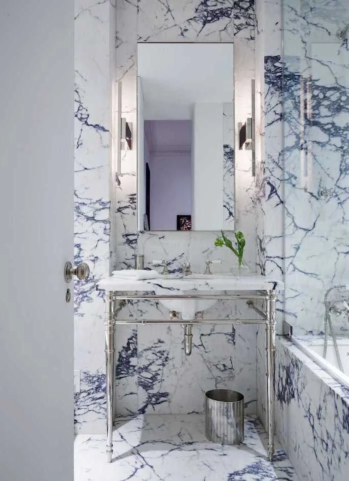 blue marble tiled wall and floor, metal floating sink, small bathroom design ideas, small mirror