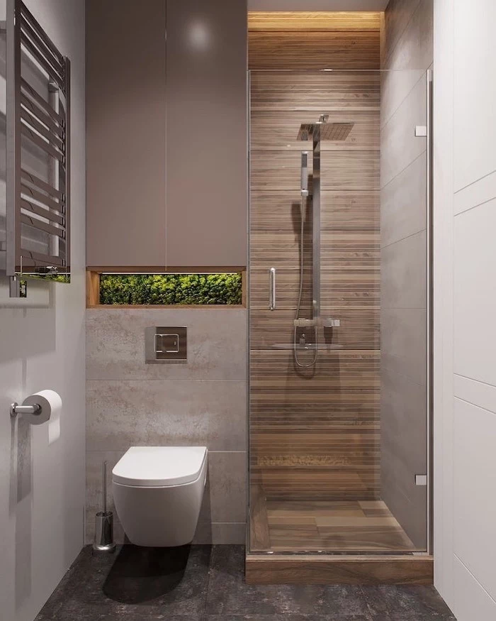 beige and grey tiled floor and walls, moss covered built in shelf, bathroom designs for small spaces, glass shower door