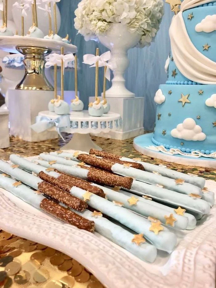 blue chocolate sticks, blue and golden moon cake pops, baby shower decoration ideas, blue cake