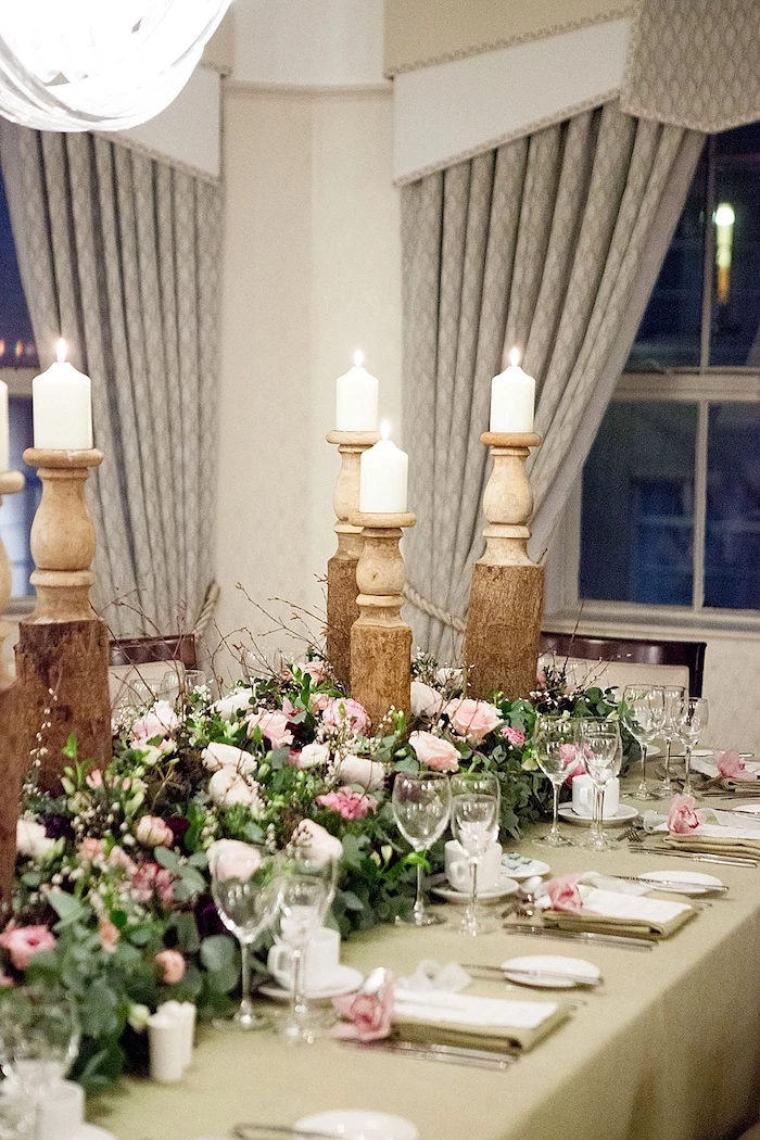 candlesticks with candles, pink and white roses flower arrangements, wedding reception decoration ideas