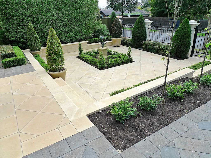 tiled floor, landscaping ideas for front of house, ceramic pots with trees, small hedges, patches of bushes