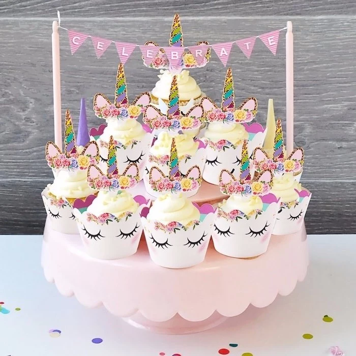 yellow buttercream cupcakes, rainbow coloured horns, pink cupcake stand, how to make a unicorn cake