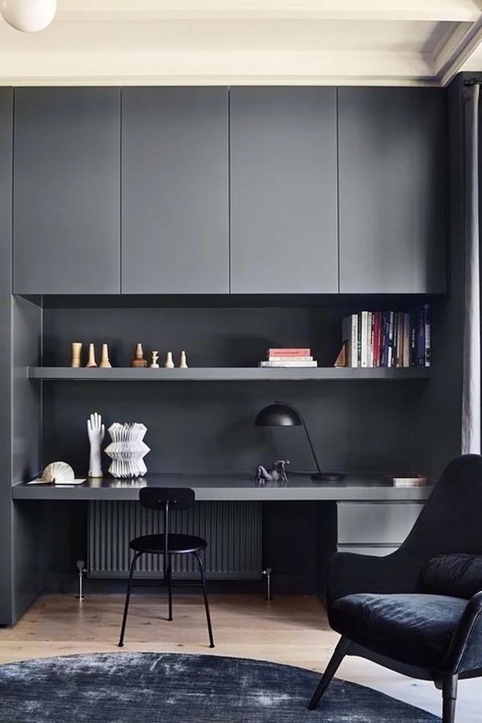 grey cupboards shelf and desk, home office design, black chair, black velvet rug and armchair