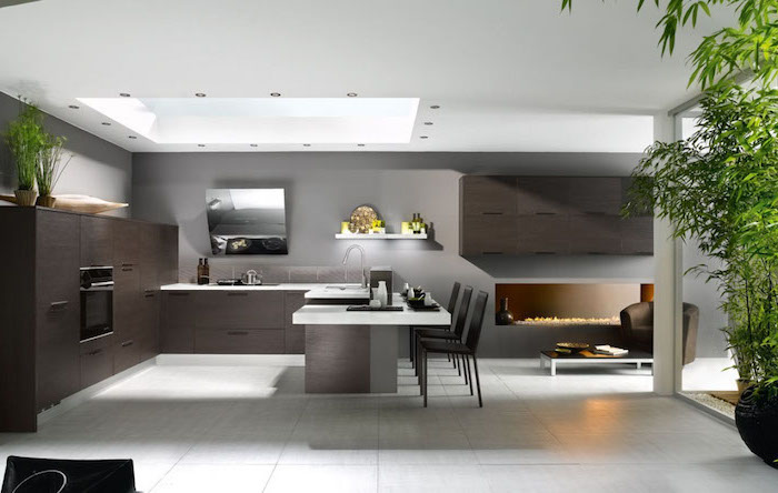 white tiled floor, white counters, kitchen wall decor ideas, dark wooden cabinets drawers and kitchen island