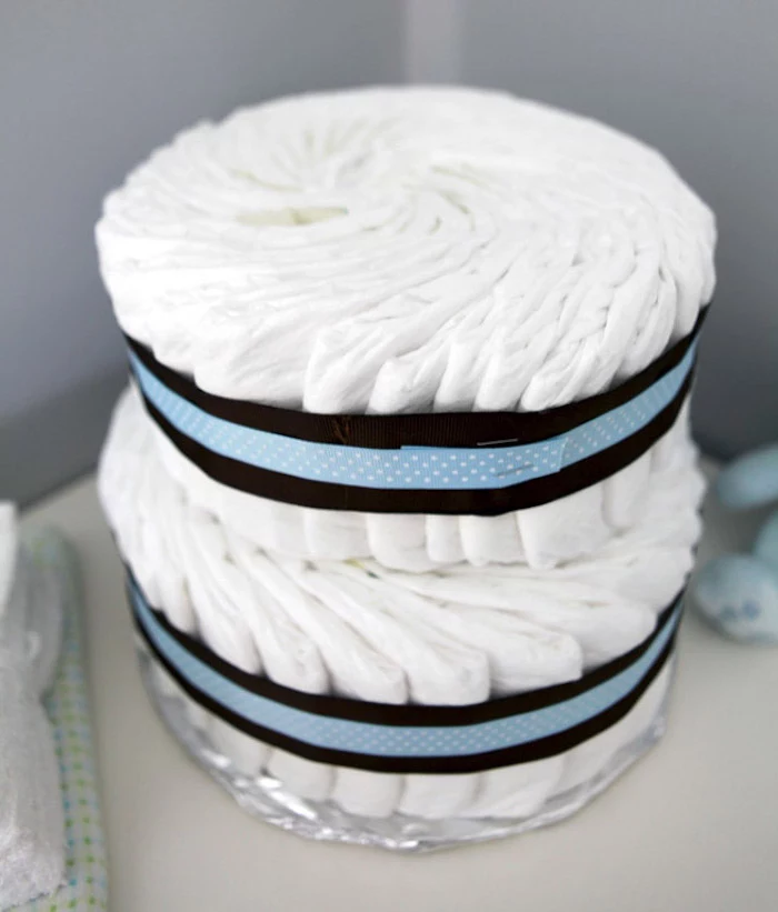 diaper cake, blue and black ribbons, baby shower themes, silver cake stand