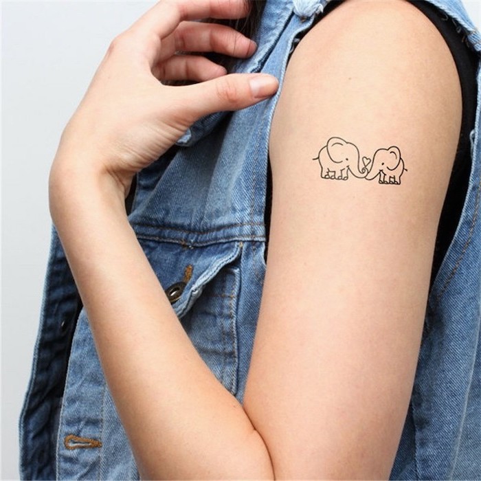 elephants in love, tattoo on the shoulder, denim jacket, tattoo designs for women, white background