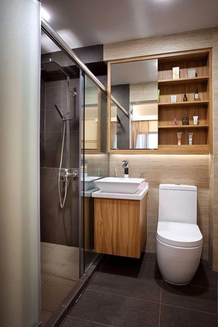 wooden floating shelf, bathroom renovation ideas, glass shower door, wooden shelves, black and beige tiled walls and floor