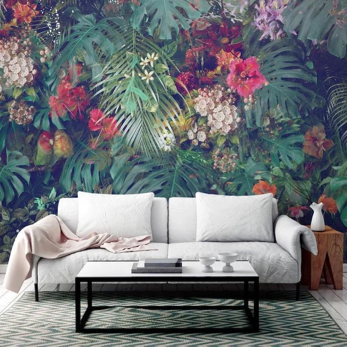 living room paint ideas, floral and palm leaves wallpaper, white sofa, green printed rug