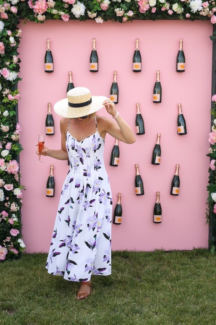 frame made out of flowers, floral dress, champagne bottles on a pink wall, bachelorette party games