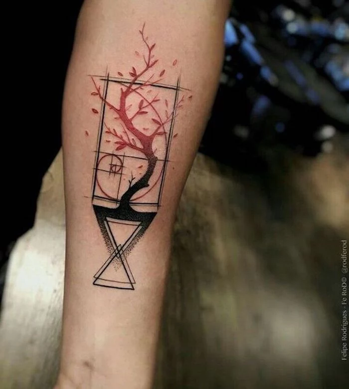 geometrical shapes with a tree, blurred background, simple tattoos for men