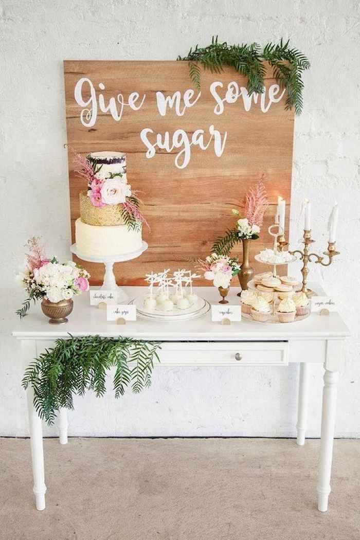 give me some sugar wooden sign, cake on a cake stand, pink and white flower bouquets, fall wedding ideas
