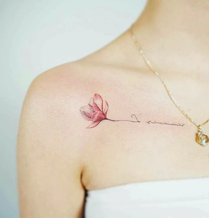 pink flower and inscription, tattoo on the shoulder, small tattoo ideas for women, golden necklace