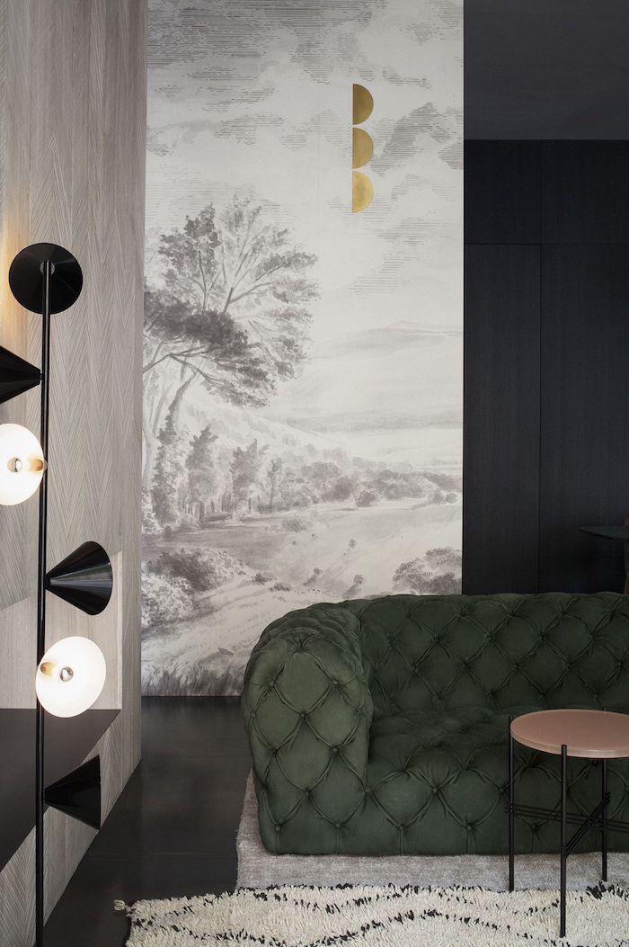 white and grey painting wallpaper, living room paint ideas, green velvet sofa, white rug, standing lamp