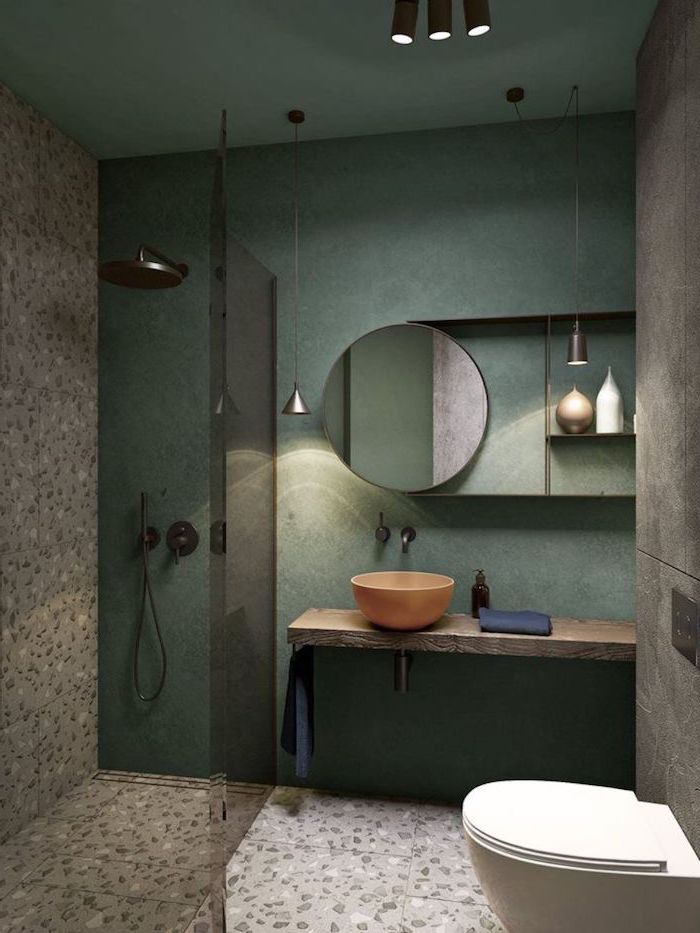 green wall, small bathroom remodel ideas, stone tiled floor and wall, glass shower door, floating wooden shelf