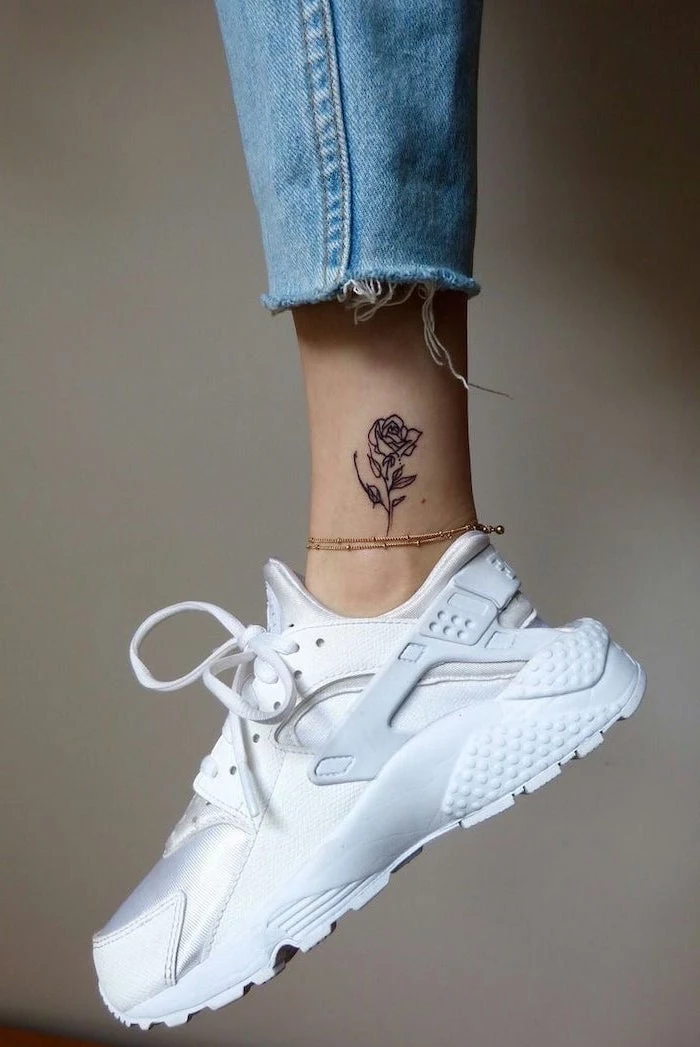 rose tattoo on the ankle, white sneakers, tattoos for girls, grey background