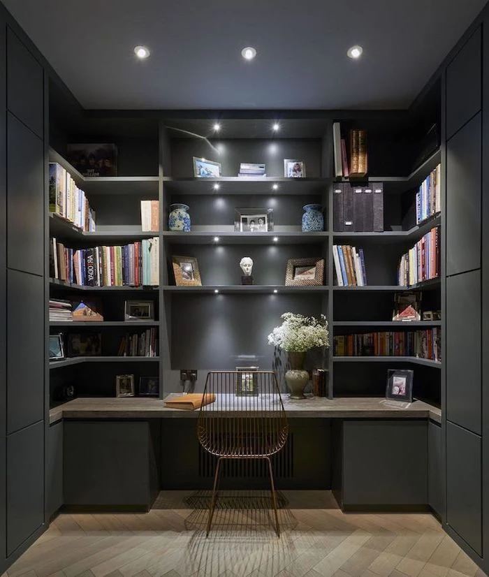 black bookcase with shelves and cabinets, wooden desk, home office setup, metal chair