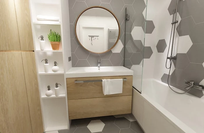 grey honeycomb tiled walls and floor, floating wooden shelves, how to decorate a bathroom, oval mirror