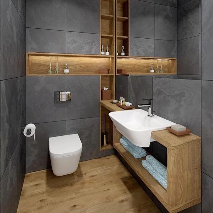 grey tiled walls, wooden floor, how to decorate a bathroom, floating and built in wooden shelves