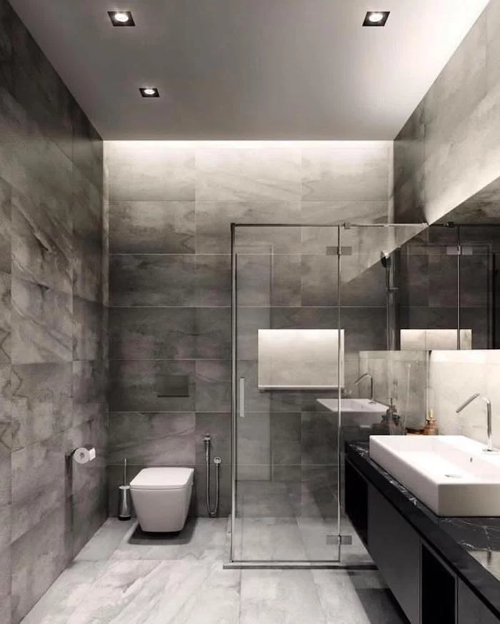 grey tiled floor and walls, glass shower door, how to decorate a bathroom, floating black cabinets