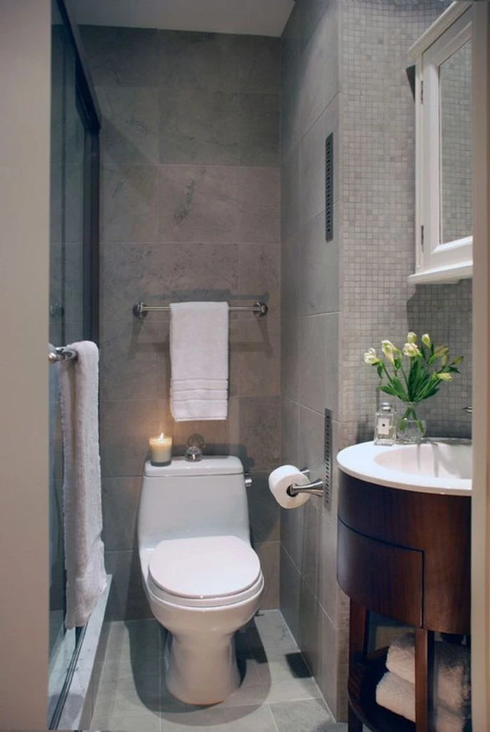 small bathroom layout, grey mosaic tiled walls and floor, oval wooden floating cabinet and sink