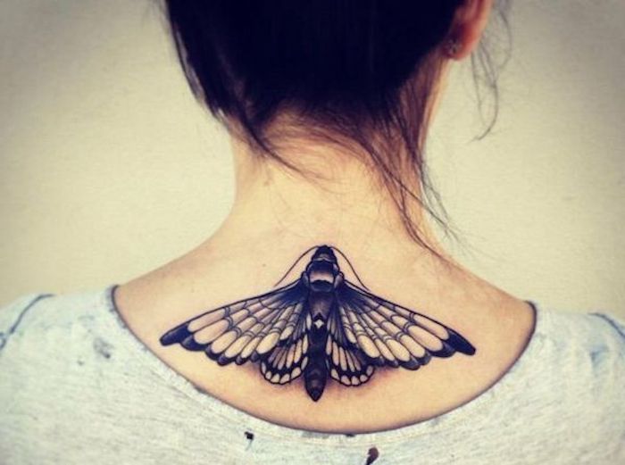 flying moth, tattoo on the back, grey top, small meaningful tattoos, white background