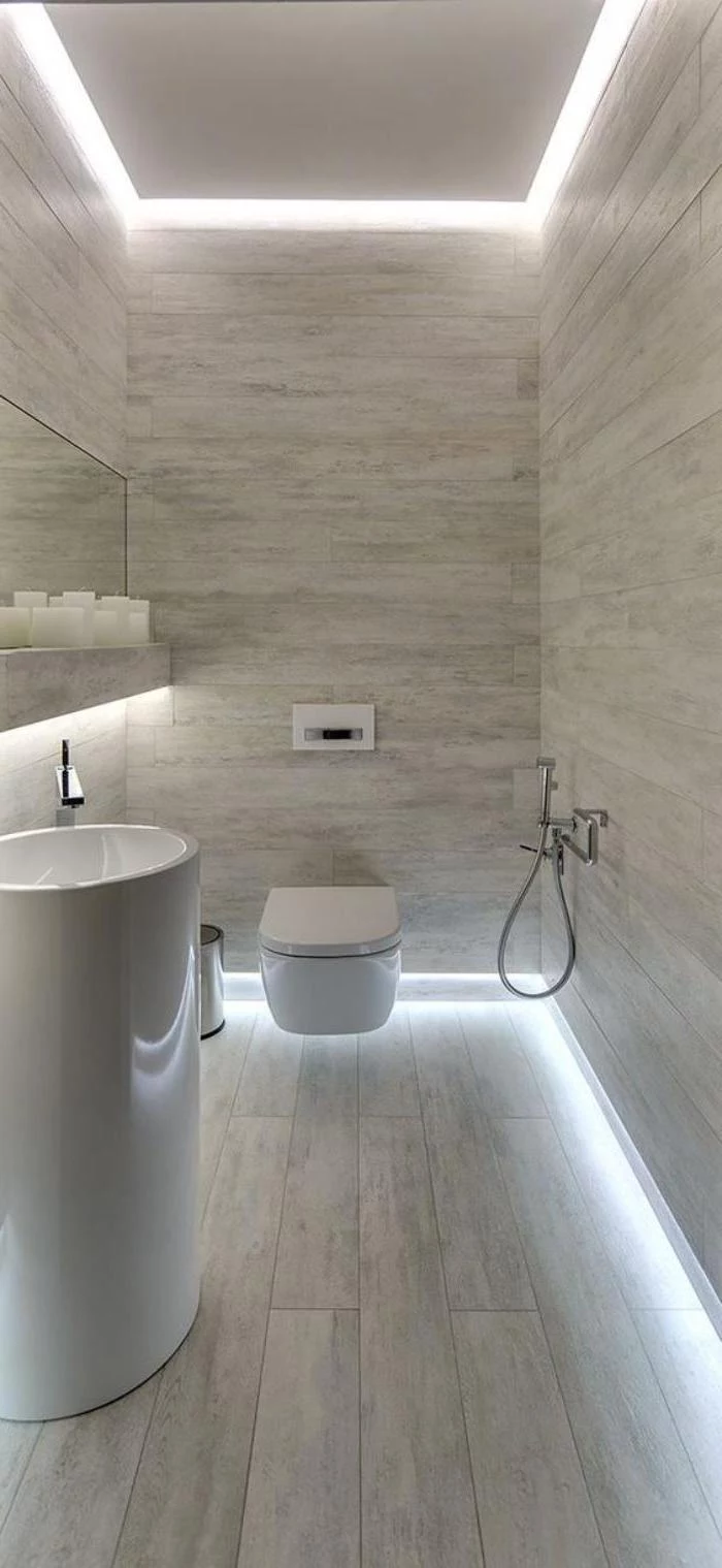 led lights, small bathroom decorating ideas, grey tiled walls and floor, white oval sink