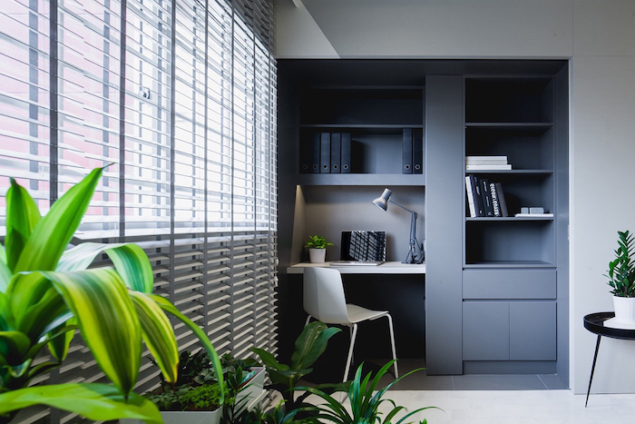 grey bookcase with shelves and cupboards, white desk and chair, desk ideas