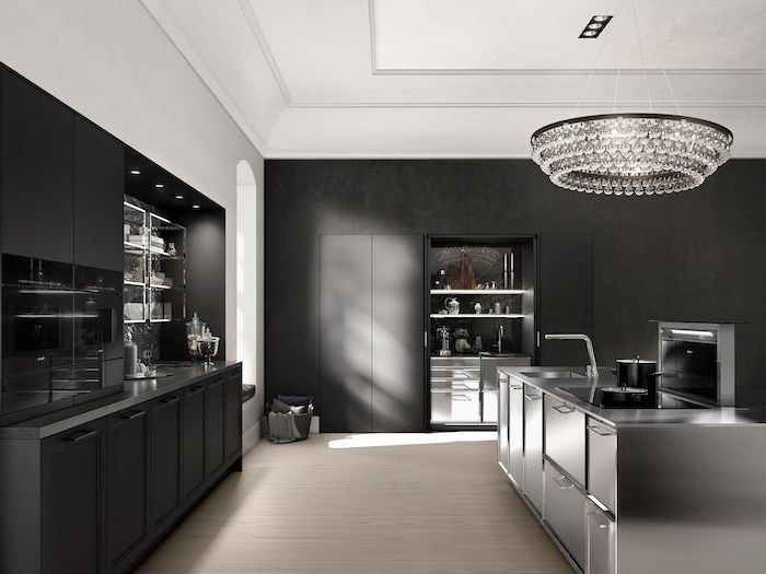 black cabinets and drawers, modern kitchen ideas, stainless steel drawers and counters, hanging chandelier