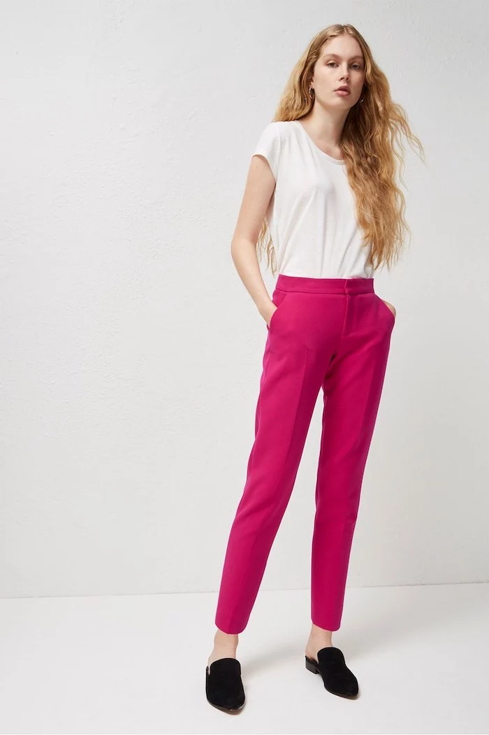 hot pink trousers, black loafers, business casual attire, white short, long blonde hair