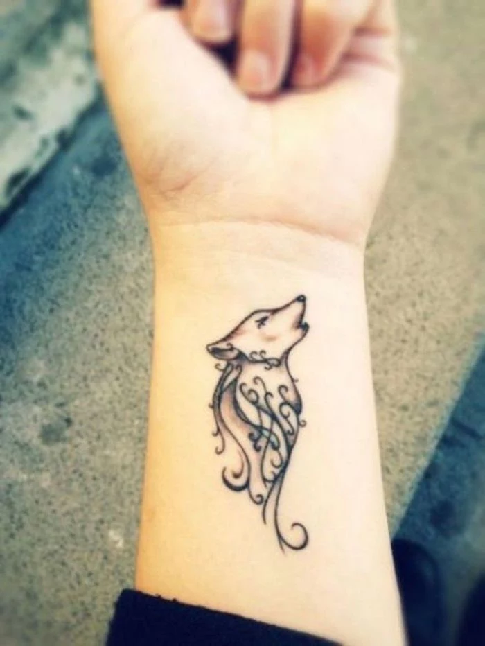 howling wolf, tattoo on the wrist, small tattoo ideas for women, grey background