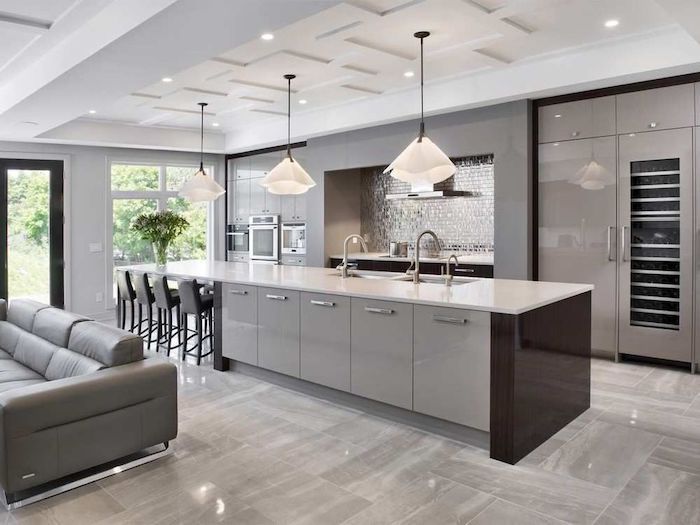 grey cabinets and kitchen island, tiled backsplash and floor, kitchen ideas, hanging lamps