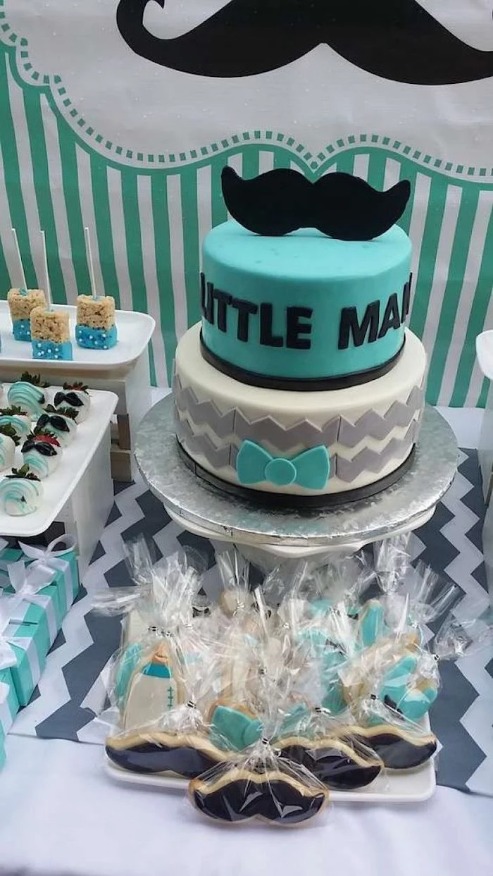 little man and moustache cake, sweets on the table, sports themed baby shower
