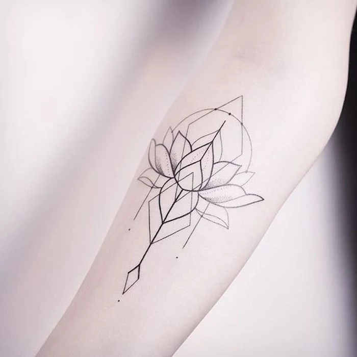geometrical lotus flower, tattoo on the forearm, tattoo motifs, blurred background